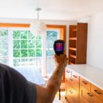 man holding camera home (fileminimizer)